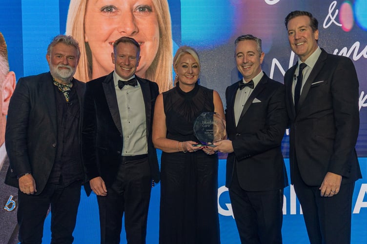 The Bluebird Care Alton, Petersfield and Havant team receives the Quality Award at the national Bluebird Care UK Awards from Hairy Biker and Bluebird Care ambassador Si King, November 7th 2025.