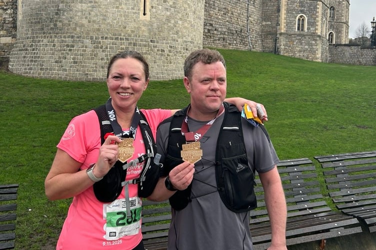 Niamh O’Hagan celebrates with her brother having completed the Windsor trail 10k
