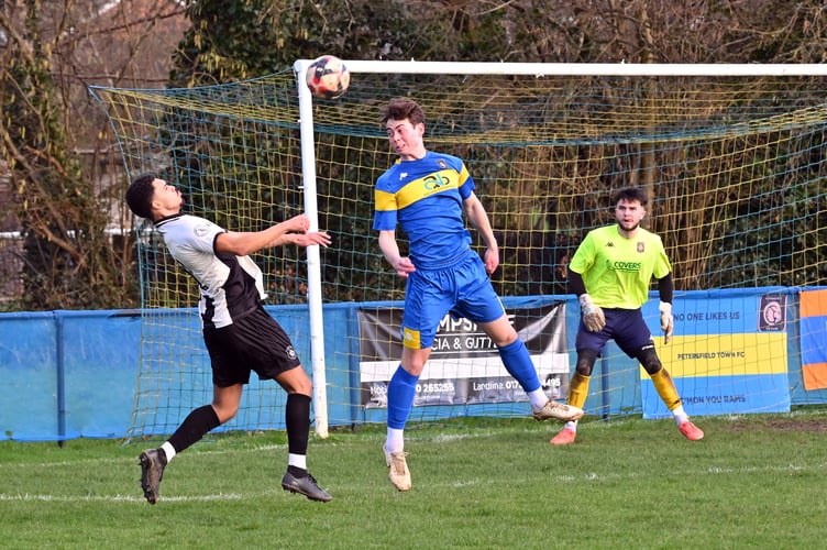 Louie McCafferty competes for a header (Photo: Malcolm Wells)