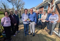 Hugh were you? Former mayor seeks answers in Galapagos postcard mystery