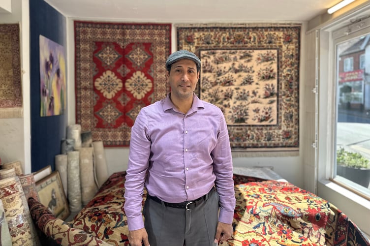 Anas Al Akhoann outside the Oriental Rug Gallery on Wey Hill. Credit: Georgia Hase