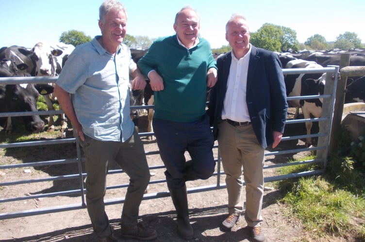 From left: Peter Caines, Ed Davey and Dominic Martin meet the cows at Stanbridge Farm, Heath Road East, Petersfield, April 30th 2026.