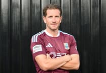 Farnham Town sign midfielder Sam Hutchinson on two-year contract