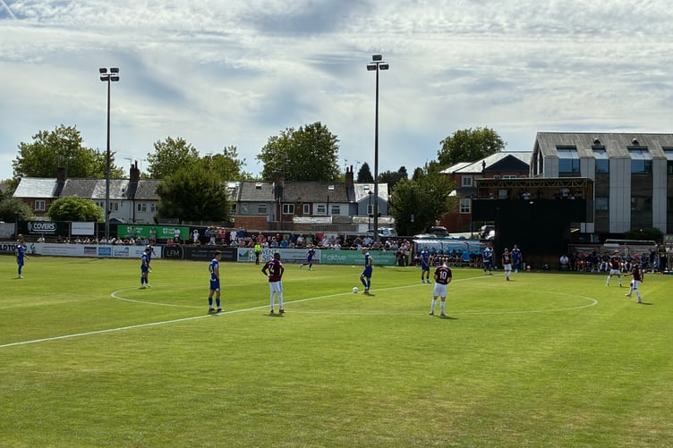 Action from Farnham Town's National League South match against AFC Totton